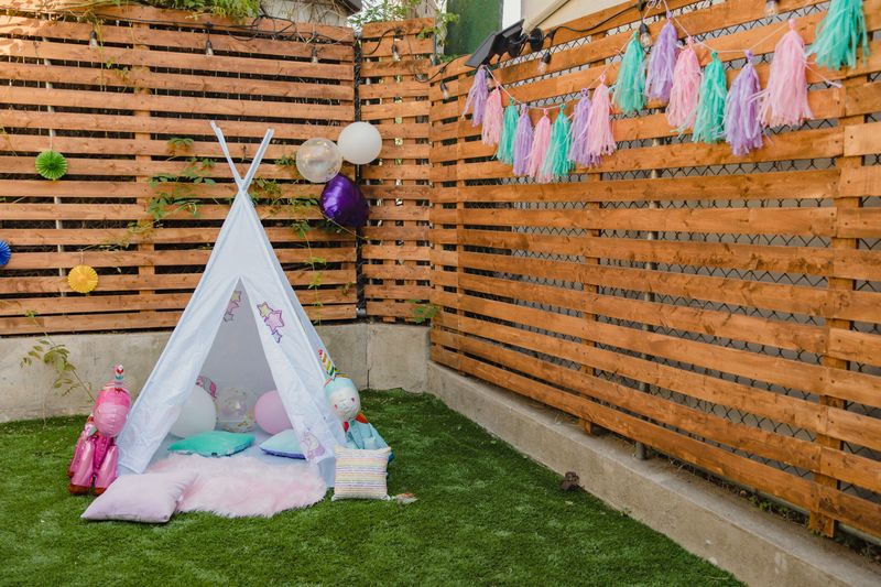 a white triangle tent and party decorations
