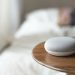 google home mini on a wooden table